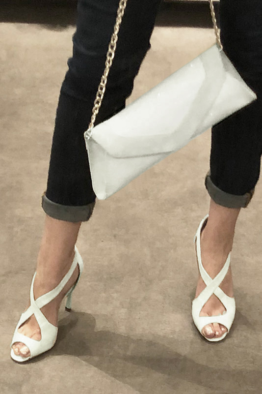 Off white women's closed back sandals, with crossed straps. Round toe. Very high slim heel. Worn view - Florence KOOIJMAN